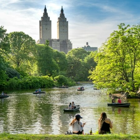 a group of people on small boats on a river