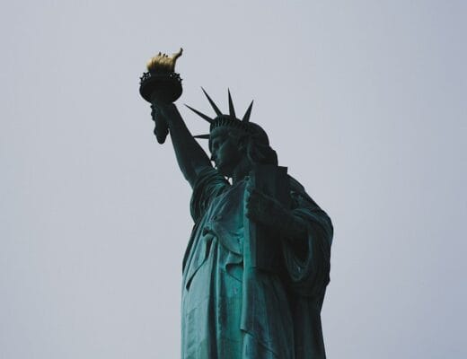 a statue of a person holding a torch