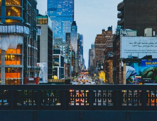 a city street filled with lots of tall buildings